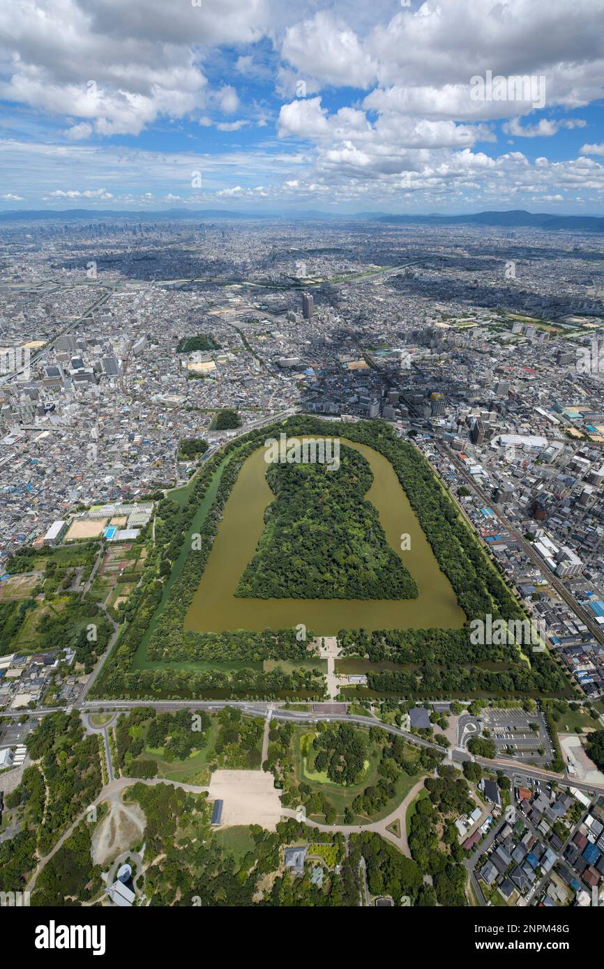 An aerial photo shows Daisen Kofun (Nintoku Tenno Ryo) that is thought to be former Japanese Emperor Nintoku's mausoleum in Sakai City, Osaka Prfecture on August 10, 2020. World Heritage Committee decided to list the "Mozu-Furuichi Kofungun, Ancient Tumulus Clusters" to as the UNESCO's world heritage in 2019. The Mozu-Furuichi Kofungun, Ancient Tumulus Clusters composed of 49 mounded tombs, which are in the Mozu and Furuichi areas in Osaka Prefecture, are a group of the greatest kofun, tumuli, that were built in 5th century Japan, including the Nintoku-tenno-ryo Kofun, the largest burial mound Stock Photo
