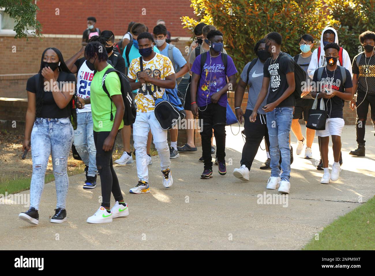 Students walk across campus Monday, August 17, 2020, as Tupelo High