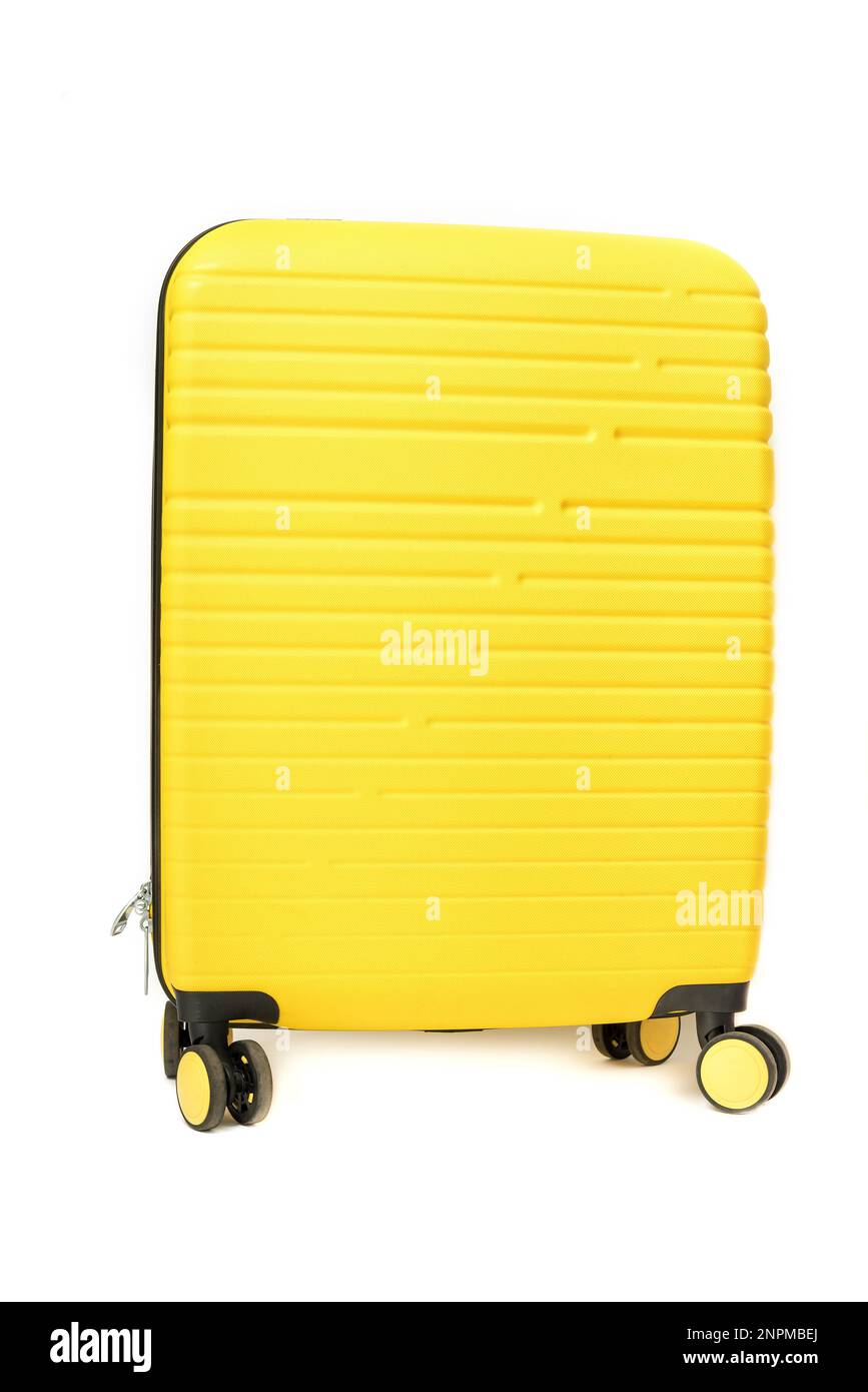 Yellow plastic suitcase isolated on white background. Stock Photo