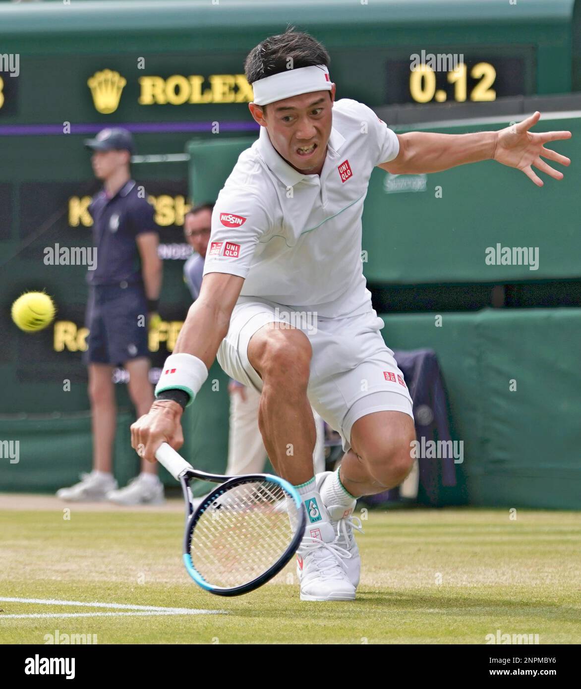 A file photo shows Kei Nishikori of Japan hiting a ball during the Men's  singles quarterfinals of the Championships, Wimbledon against Roger Federer  of Switzerland at the All England Lawn Tennis and