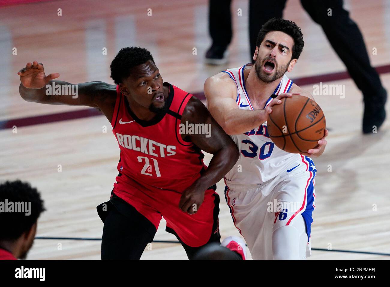 Philadelphia 76ers' Furkan Korkmaz (30) drives into Houston Rockets ...