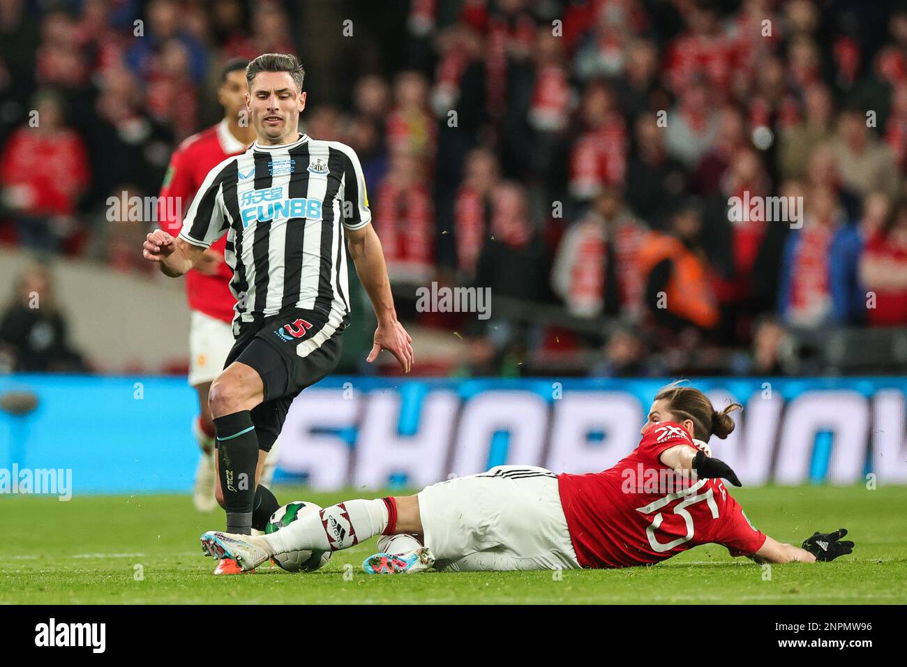 Fabian Schär #5 of Newcastle United is tackled by Marcel Sabitzer #15 of Manchester United during the Carabao Cup Final match Manchester United vs Newcastle United at Wembley Stadium, London, United Kingdom, 26th February 2023 (Photo by Mark Cosgrove/News Images) in, on 2/26/2023. (Photo by Mark Cosgrove/News Images/Sipa USA) Credit: Sipa USA/Alamy Live News Stock Photo