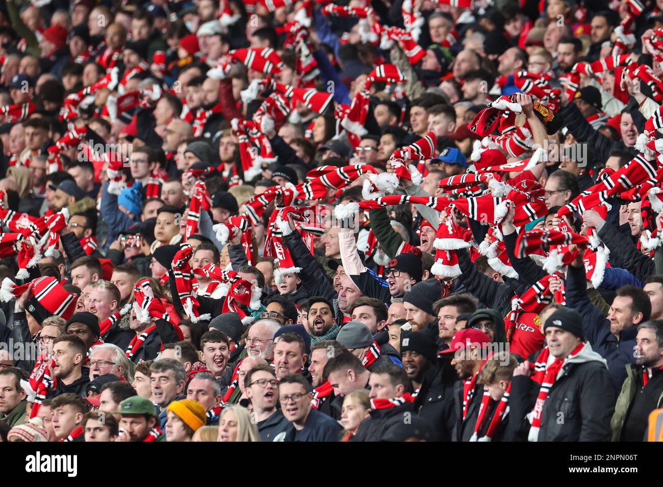 Manchester United Fans Sing And Wave Their Scarves During The Carabao