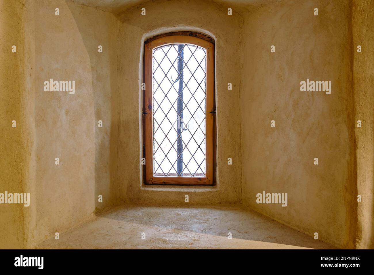 Old window from interior of a medieval castle. Stock Photo