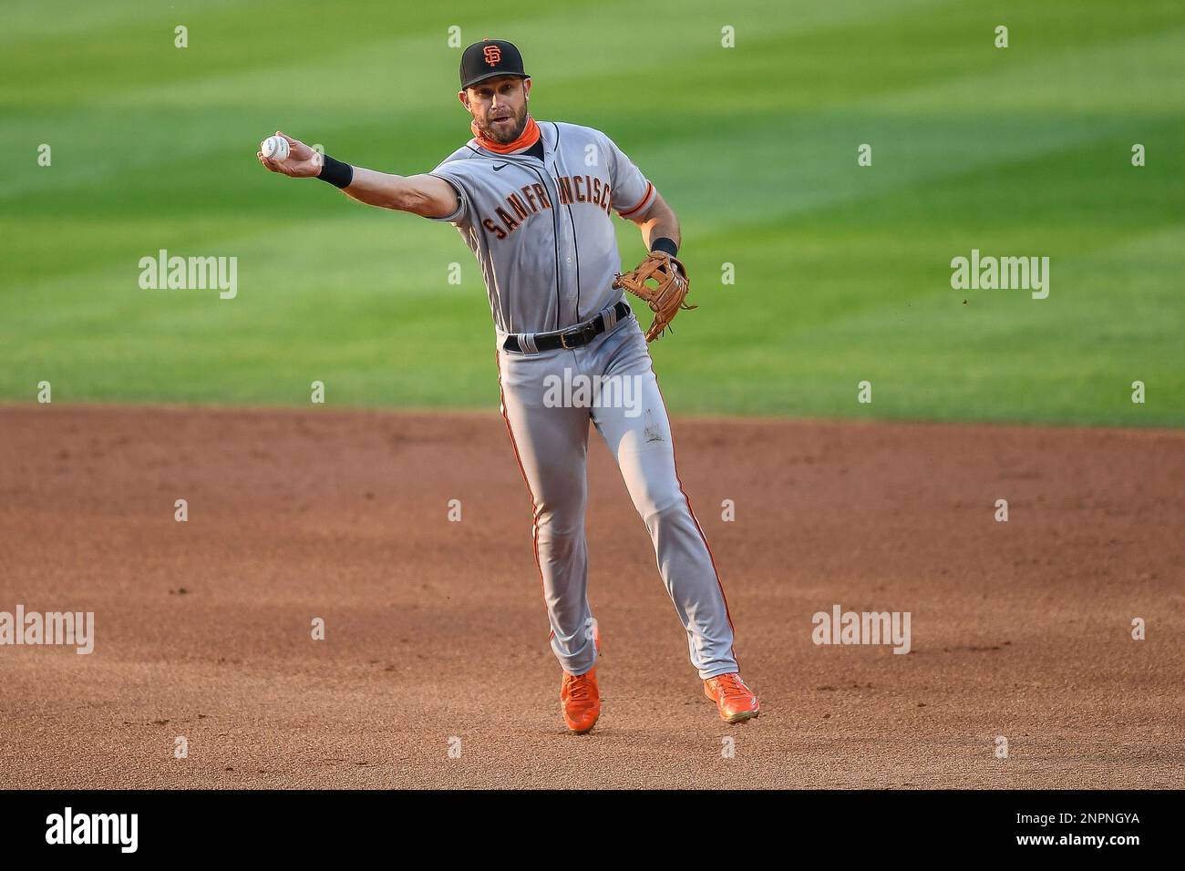 DENVER, CO - AUGUST 04: San Francisco Giants third baseman Evan Longoria  (10) throws to first base after fielding a ground ball during a game  against the Colorado Rockies at Coors Field