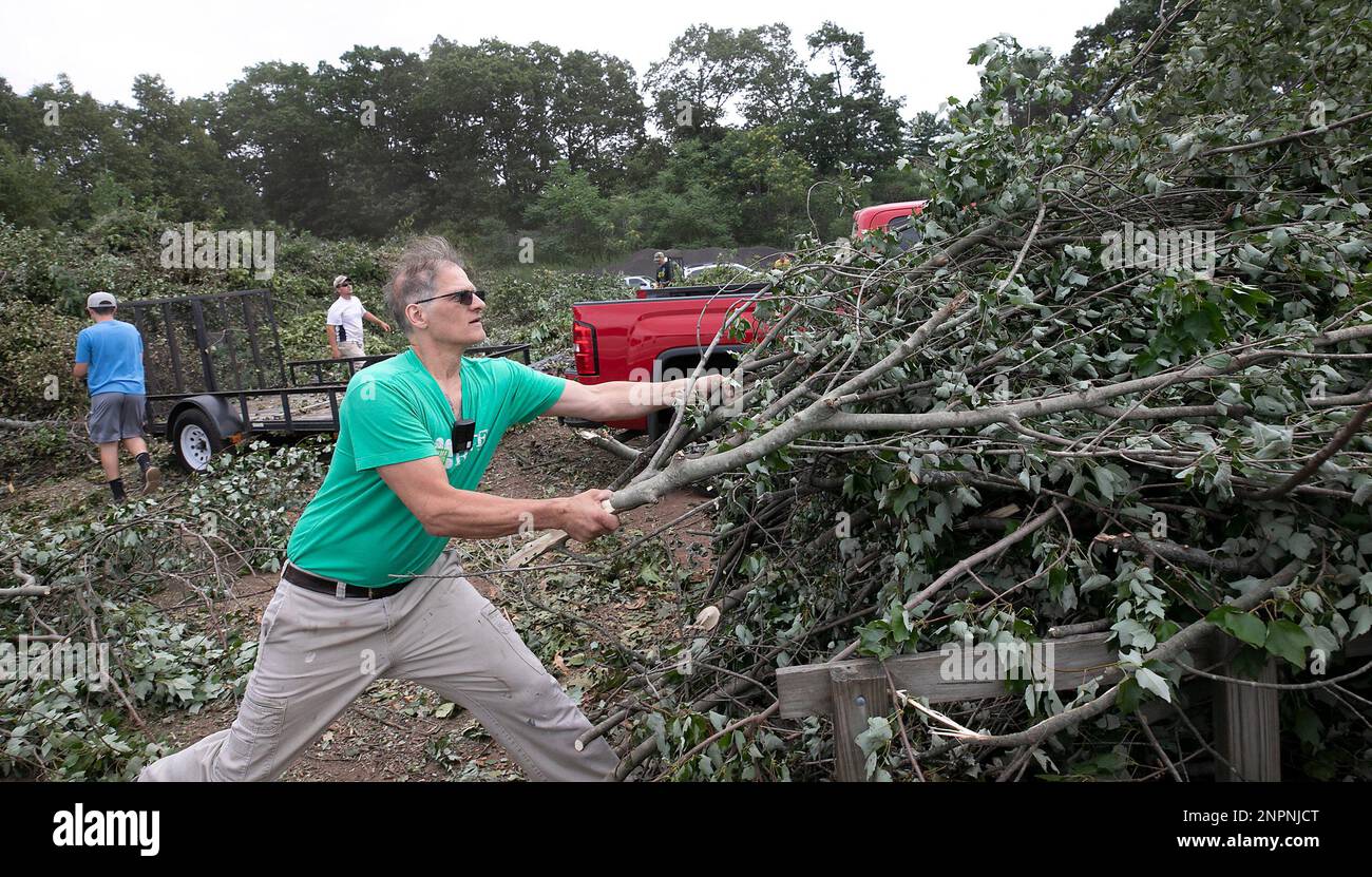 August Riedinger pulls a pile of brush off his trailer at the transfer