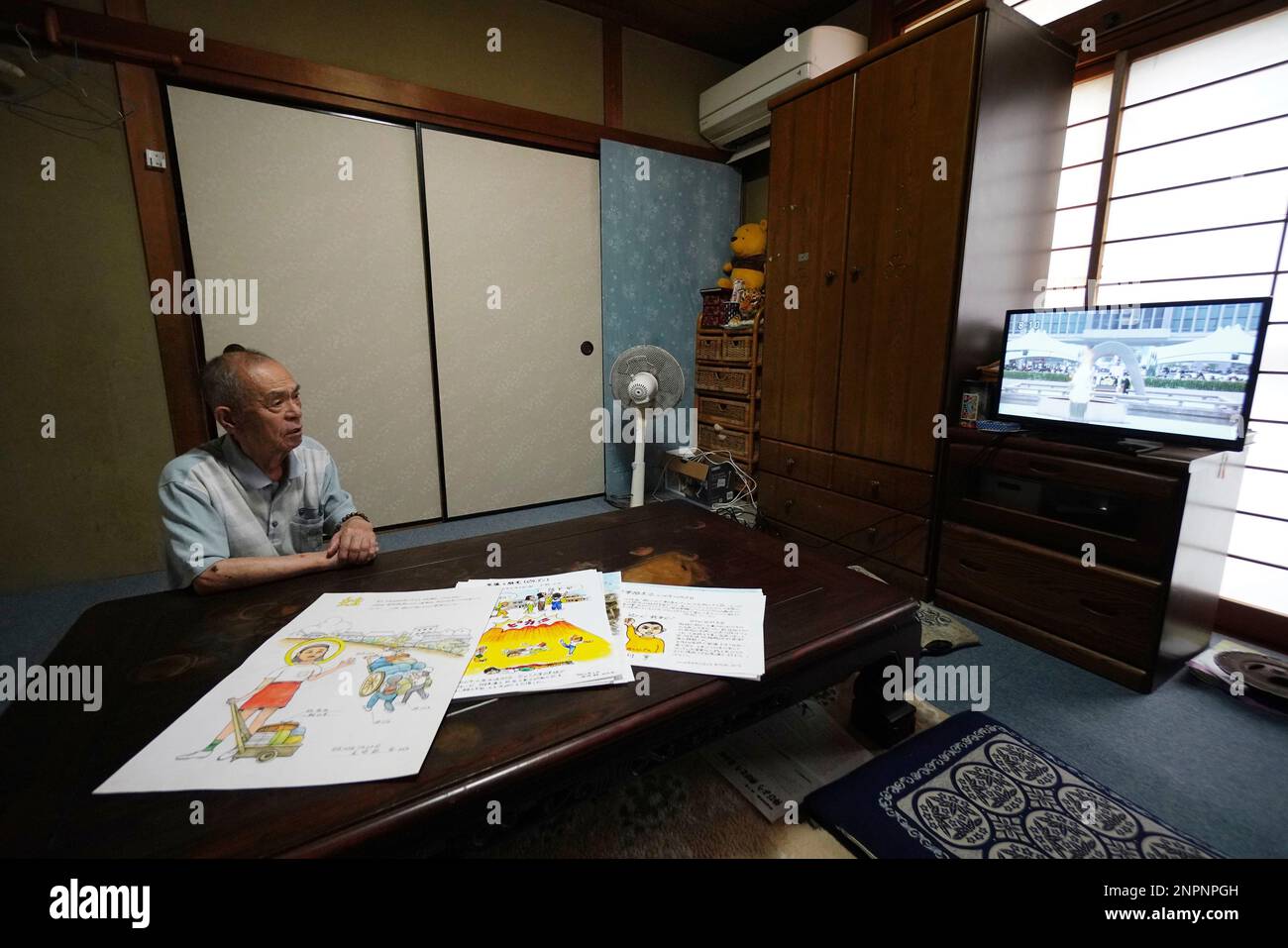 An atomic bomb victim Minoru Ozaki watches television featuring the  Hiroshima Peace Memorial Ceremony at his home in Hiroshima City, Hiroshima  Prefecture on August 6, 2020. 88-year-old Ozaki had been attending the