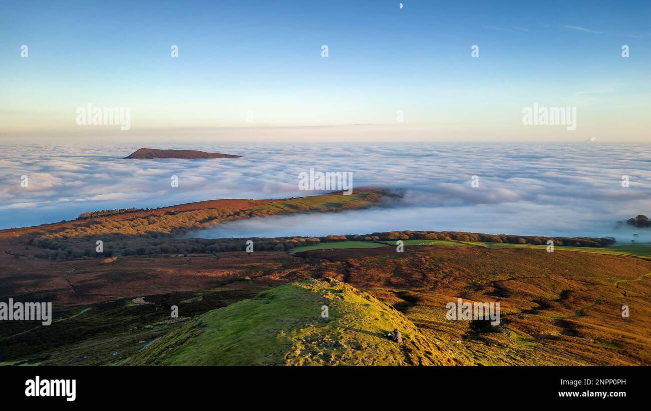 Aerial view of hillsides above a temperature inversion and sea of fog ...