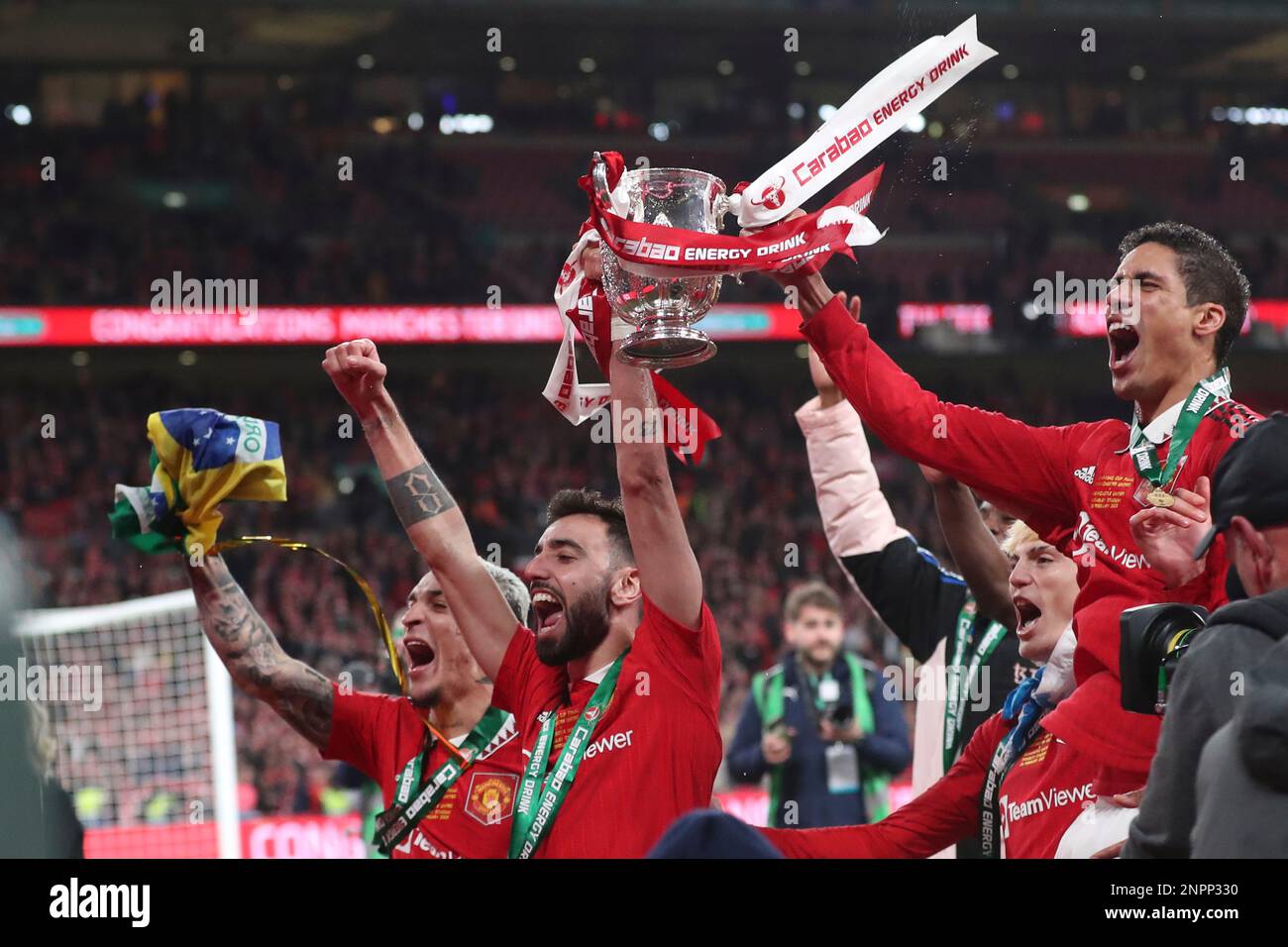 Manchester Uniteds Bruno Fernandes Holds The Trophy Aloft As He Celebrates With Teammates After 6894