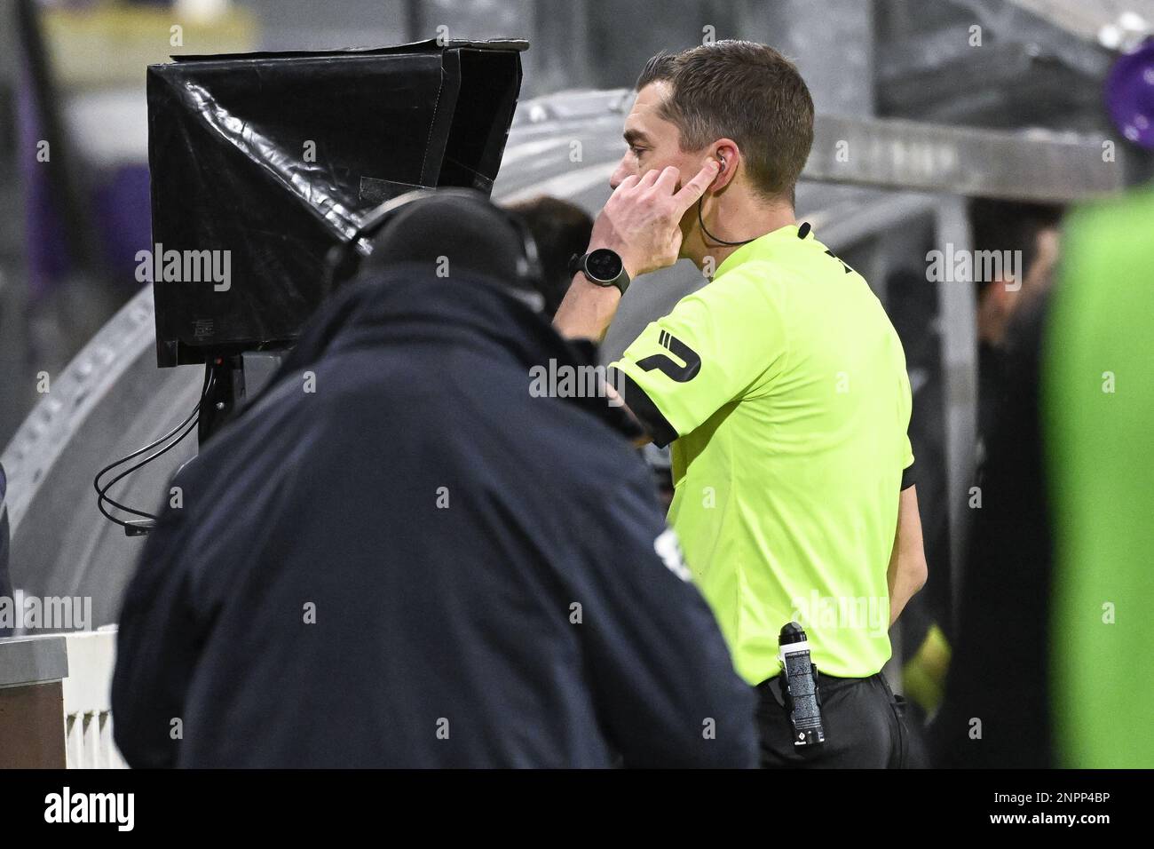 referee Jonathan Lardot pictured watching a scene on the VAR video assistant referee screen during a soccer match between RSC Anderlecht and Standard de Liege, Sunday 26 February 2023 in Brussels, on day 27 of the 2022-2023 'Jupiler Pro League' first division of the Belgian championship. BELGA PHOTO LAURIE DIEFFEMBACQ Stock Photo