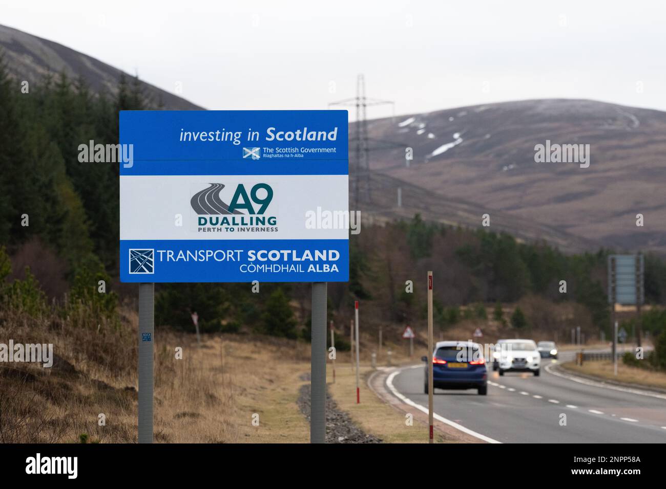 A9 Perth to Inverness dualling sign next to stretch of single carriageway, Scotland, UK Stock Photo