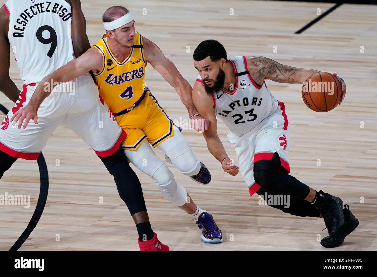 Toronto Raptors' Fred VanVleet (23) drives into Los Angeles Lakers