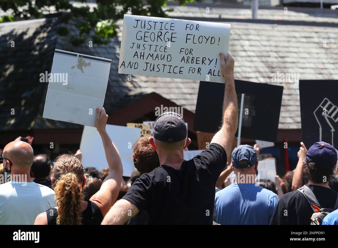 MILLBURN, NJ JUN 07 A peaceful group of very diverse protesters hold