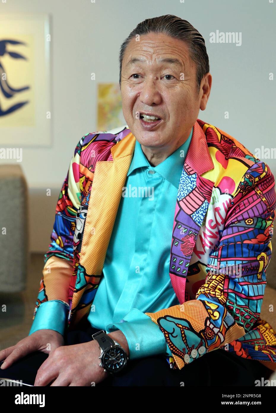 A file photo shows Japanese fashion designer Kansai Yamamoto speaks during  an interview in Tokyo on April 23, 2013. 76-year old Yamamoto made his  debut in 1971 as the first Japanese and