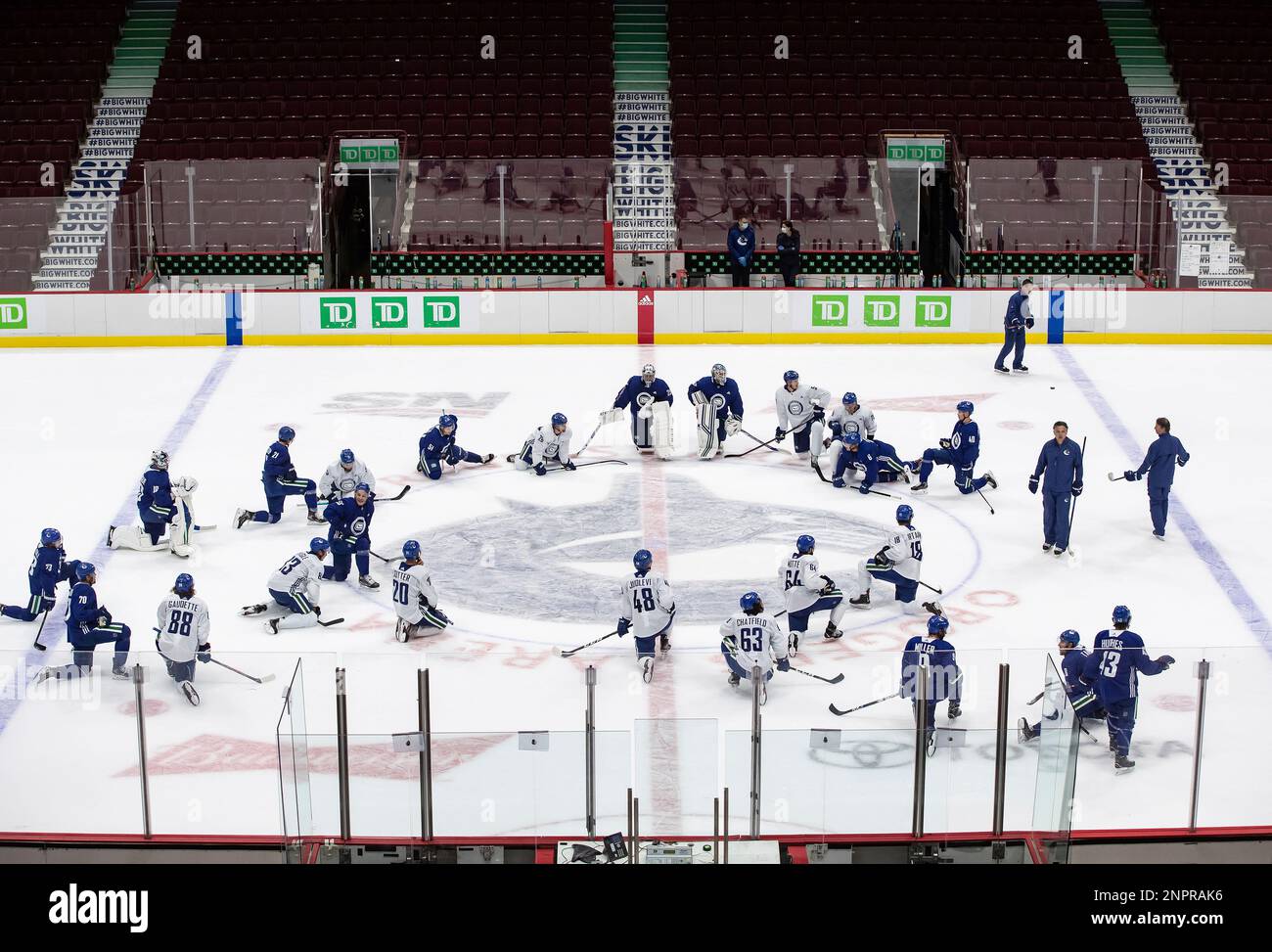 Vancouver Canucks players pause on the ice after their last practice on ...