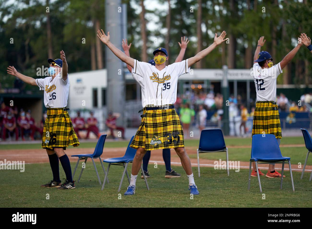 Savannah Bananas players, lead by pitcher Alex Degen (35), perform a