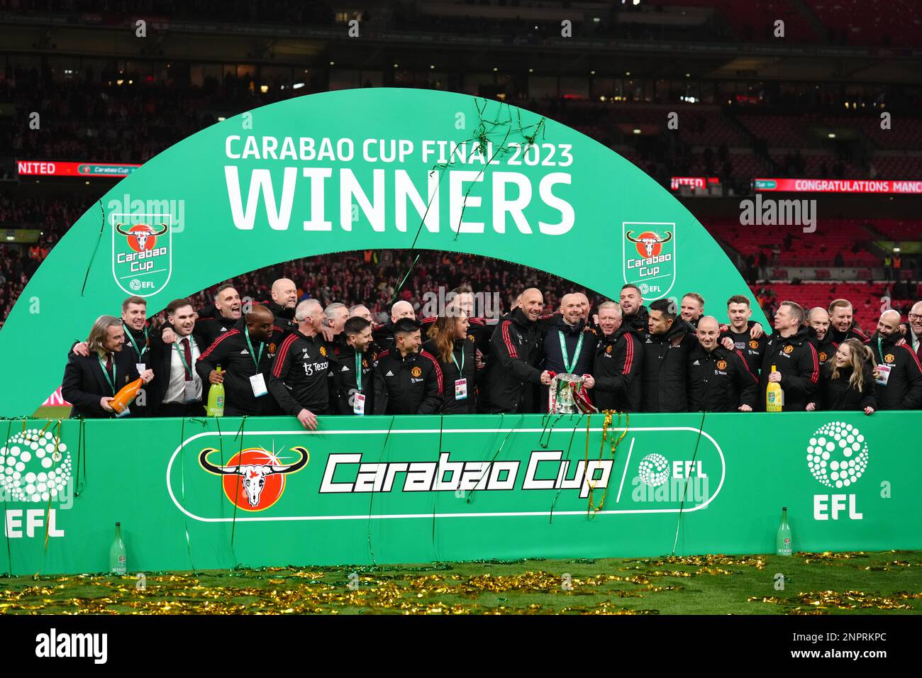 manchester-united-backroom-staff-celebrate-with-the-trophy-after-the
