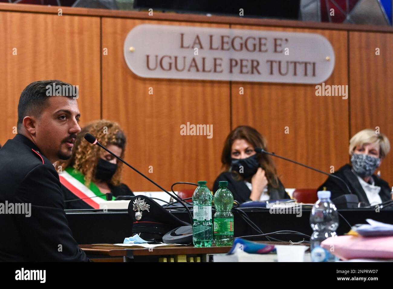 Judge Marina Finiti, right, looks to Italian Carabinieri paramilitary ...