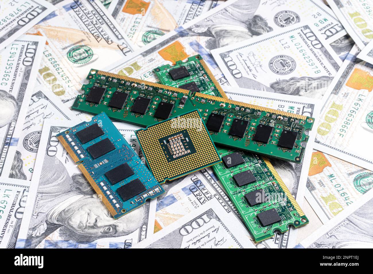 Computer CPU and memory chips on US dollar banknotes background. The