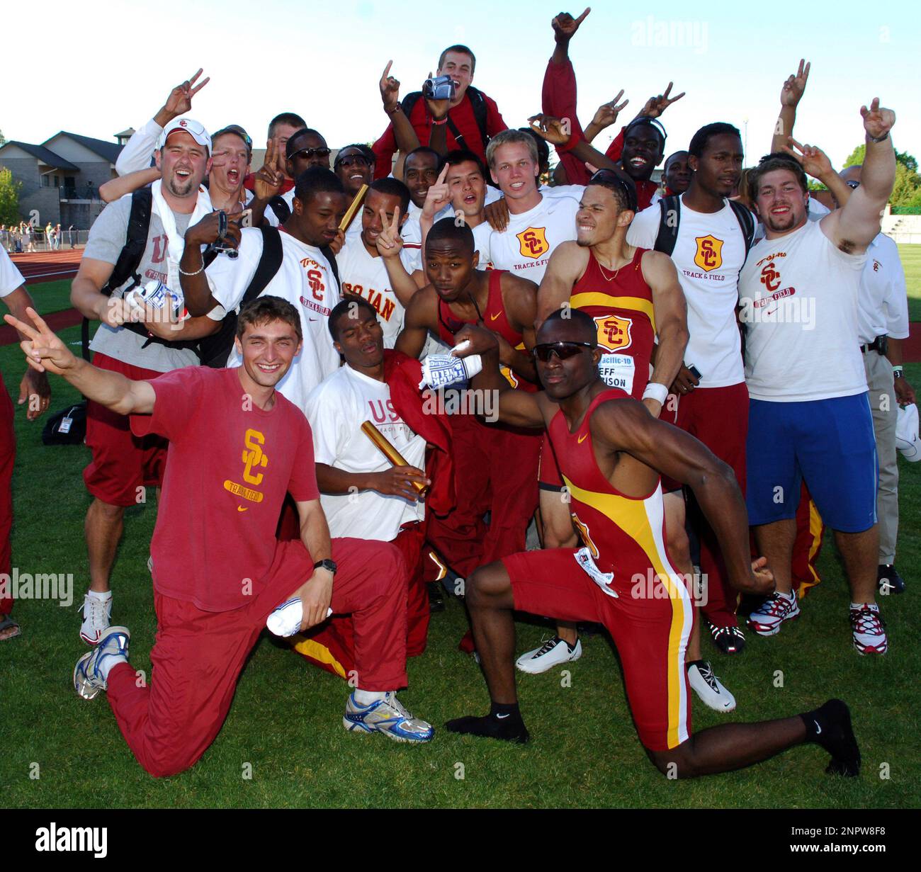 The USC men celebrate after winning the team title in the Pacific10