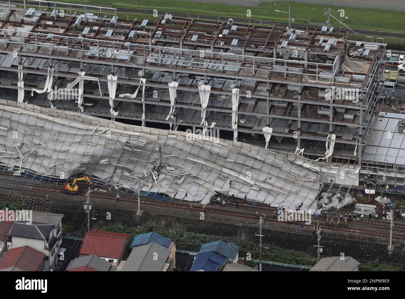 An aerial photo shows scaffolds being collapsed at the construction