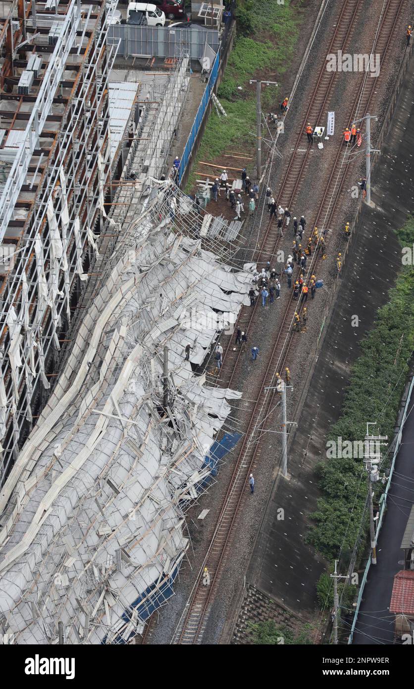An aerial photo shows scaffolds being collapsed at the construction