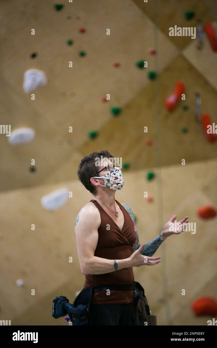 Molly Beard wears a mask as she shares her experience a world