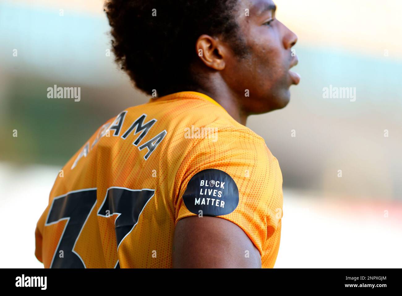 Wolverhampton Wanderers' Adama Traore wears a "Black Lives Matter" badge on  his shirt during the English Premier League soccer match between  Wolverhampton Wanderers and Bournemouth at the Molineux Stadium in  Wolverhampton, England,