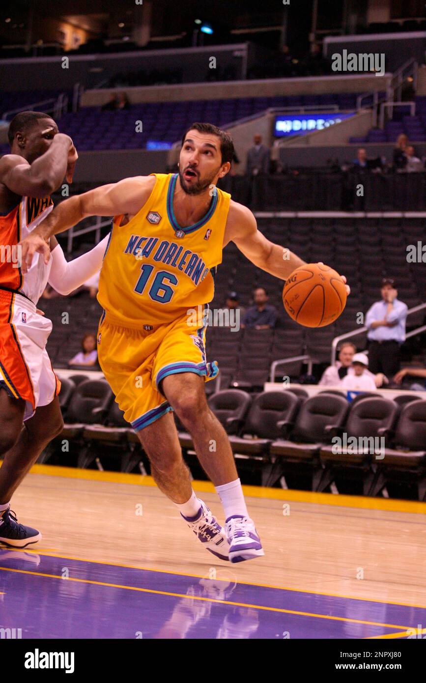 New Orleans/Oklahoma City Hornets forward Peja Stojakovic (16) makes a move  with the basketball against the Golden State Warriors during an NBA  preseason game, Oct. 19, 2006 in Los Angeles. The Warriors