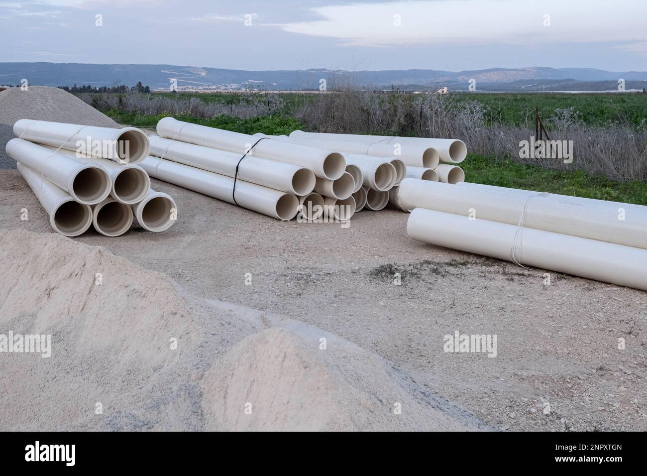 Plumbing. new PVC pipe heap, pile near the construction site for the preparation of the sewer