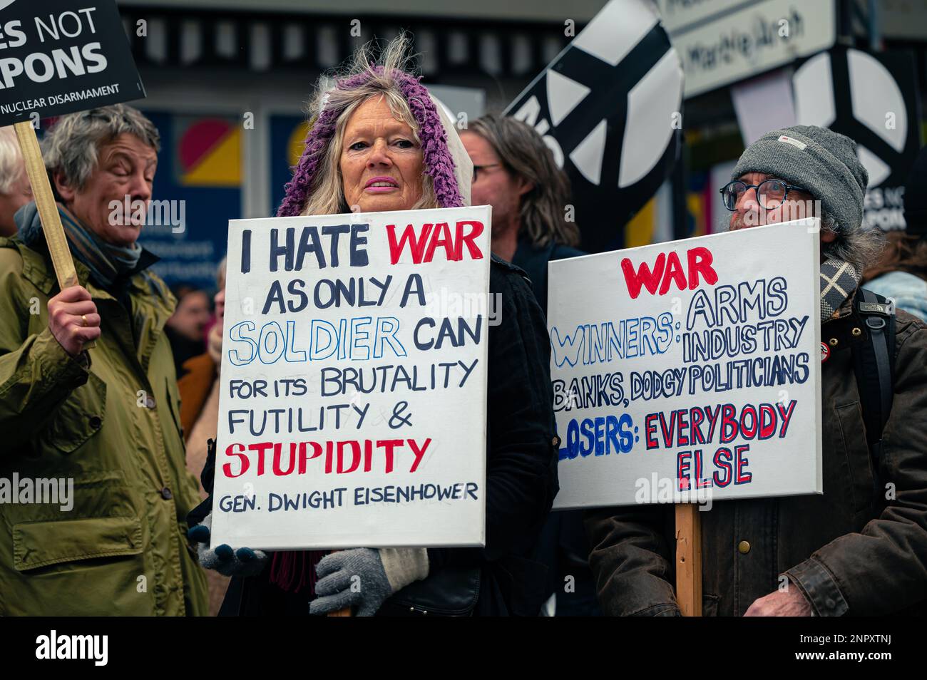 Woman holding an anti-war sign at a protest Stock Photo