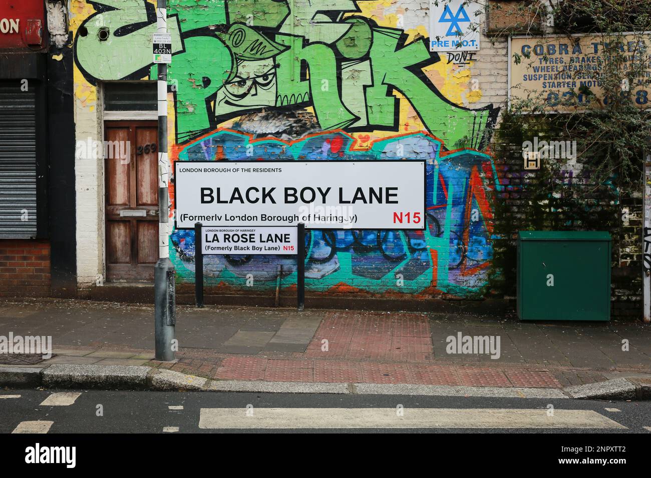London, UK. 26 Jan 2023. Residents put up a large Black Boy Lane street sign in protest after