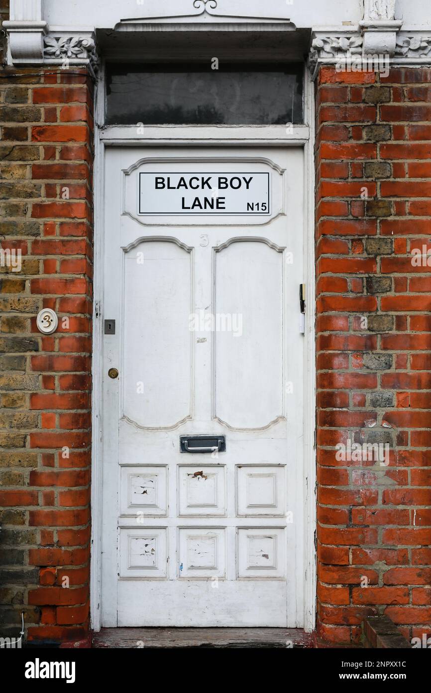 London, UK. 26 Jan 2023. Residents put up a Black Boy Lane sign on their homes in protest after