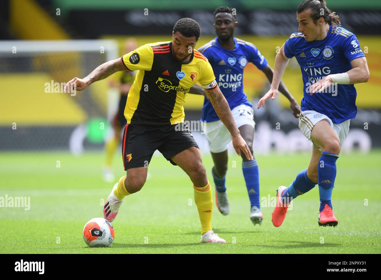 Watfords Troy Deeney, left, in action during the English Premier League soccer match between Watford and Leicester City at the Vicarage Road Stadium in Watford, England, Saturday, June 20, 2020