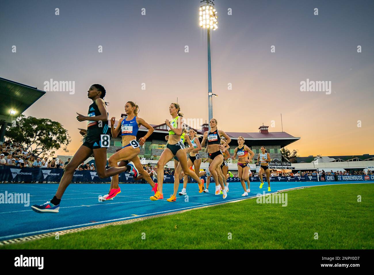 The sun sets during the Women’s 1500m at the Maurie Plant Meet held at Lakeside Stadium, Melbourne on 23/02/23. Stock Photo