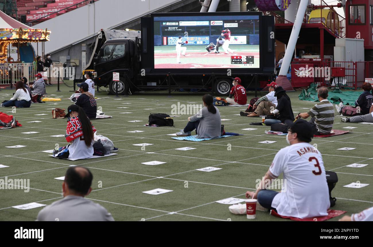 Fans of Rukuten Eagles take spaces as they enjoy live broadcast of an opening baseball game against Softbank Hawks at Rakuten Seimei Park Miyagi in Sendai, Miyagi Prefecture on June 19, 2020.