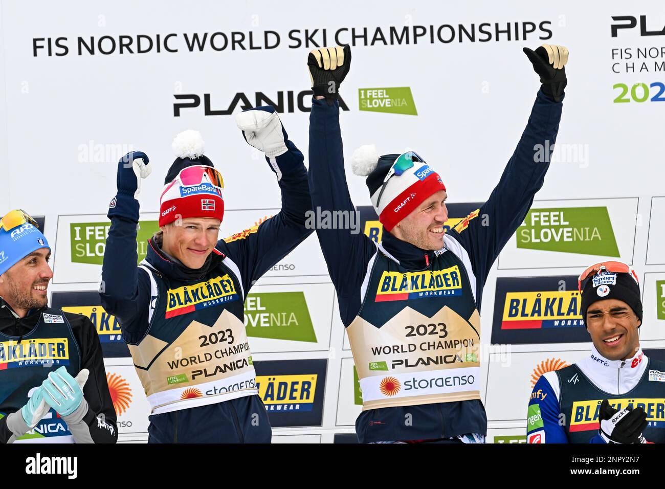 Winners Johannes Hoesflot Klaebo and Paal Golberg of Norway celebrate on podium during the Man's Team Sprint Free Race competition at the FIS Nordic World Ski Championships 2023. Stock Photo