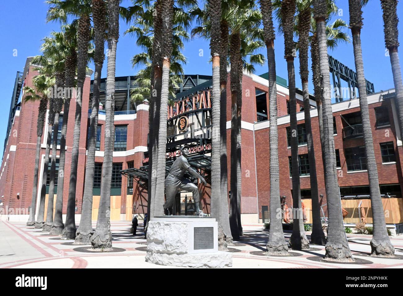 The Willie Mays statue in front of a boarded up Oracle Park during