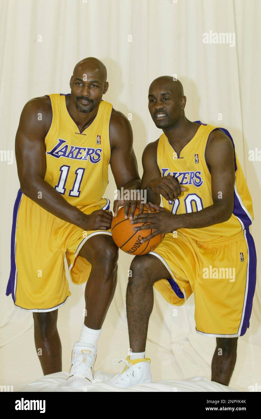Los Angeles Lakers forward Karl Malone 11 and guard Gary Payton 20 have their photo taken during Lakers Media Day. Oct. 10 2003 in El Segundo Calif. Kevin Reece via AP Stock Photo Alamy