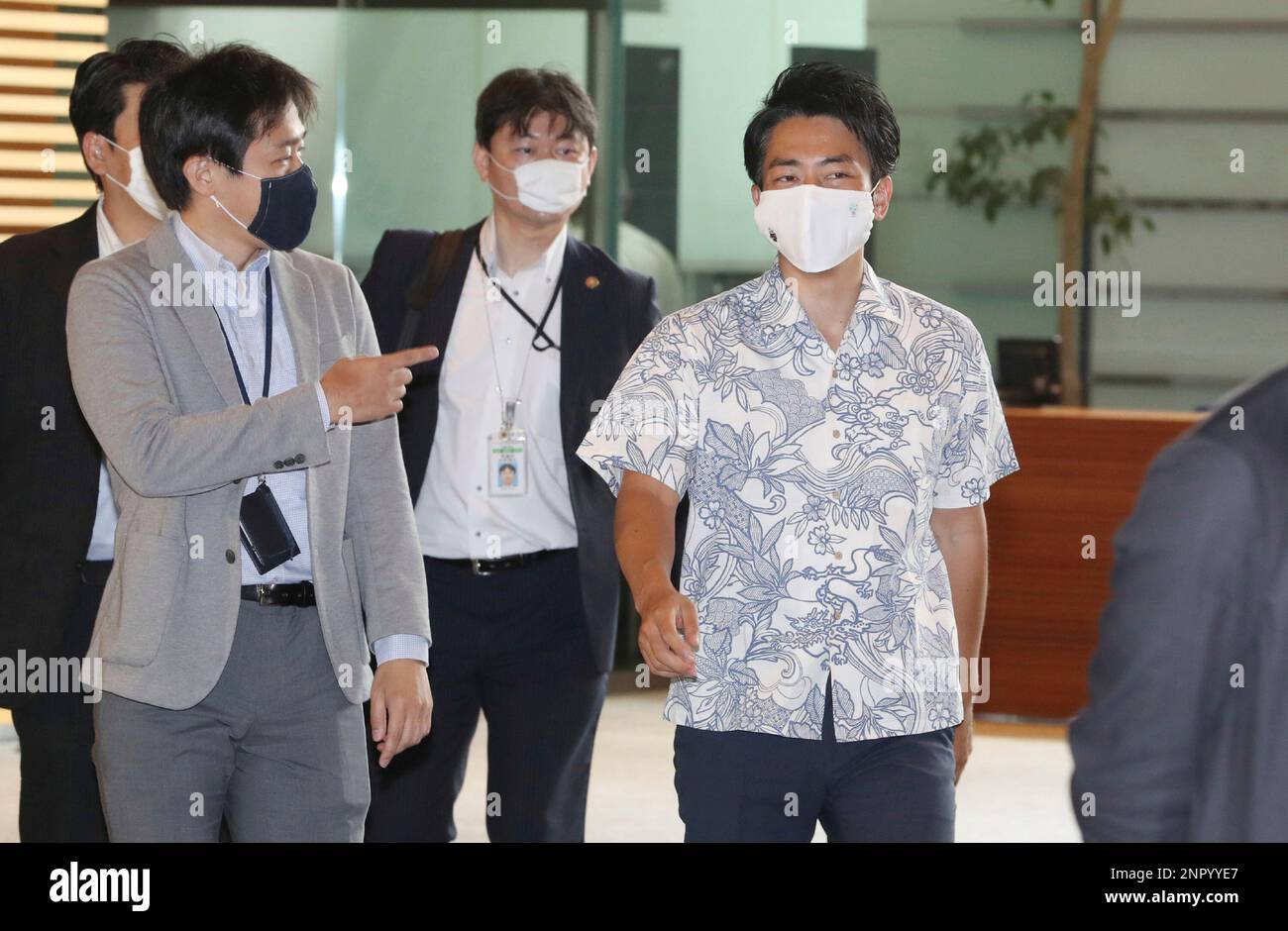 Japan's Minister of the Environment Shinjiro Koizumi (L) arrives at