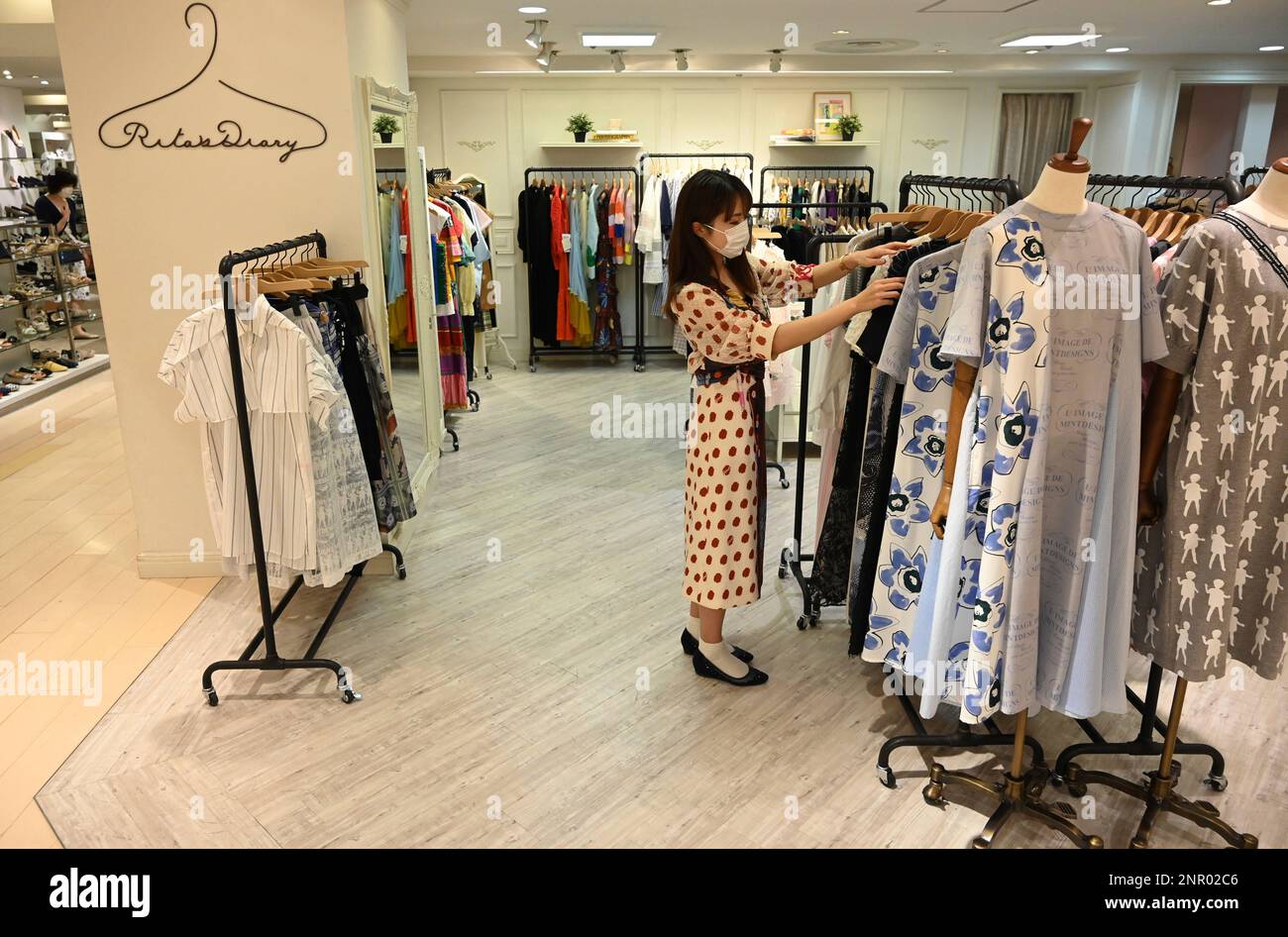 Clothes are displayed with wide space at women's section of a ...