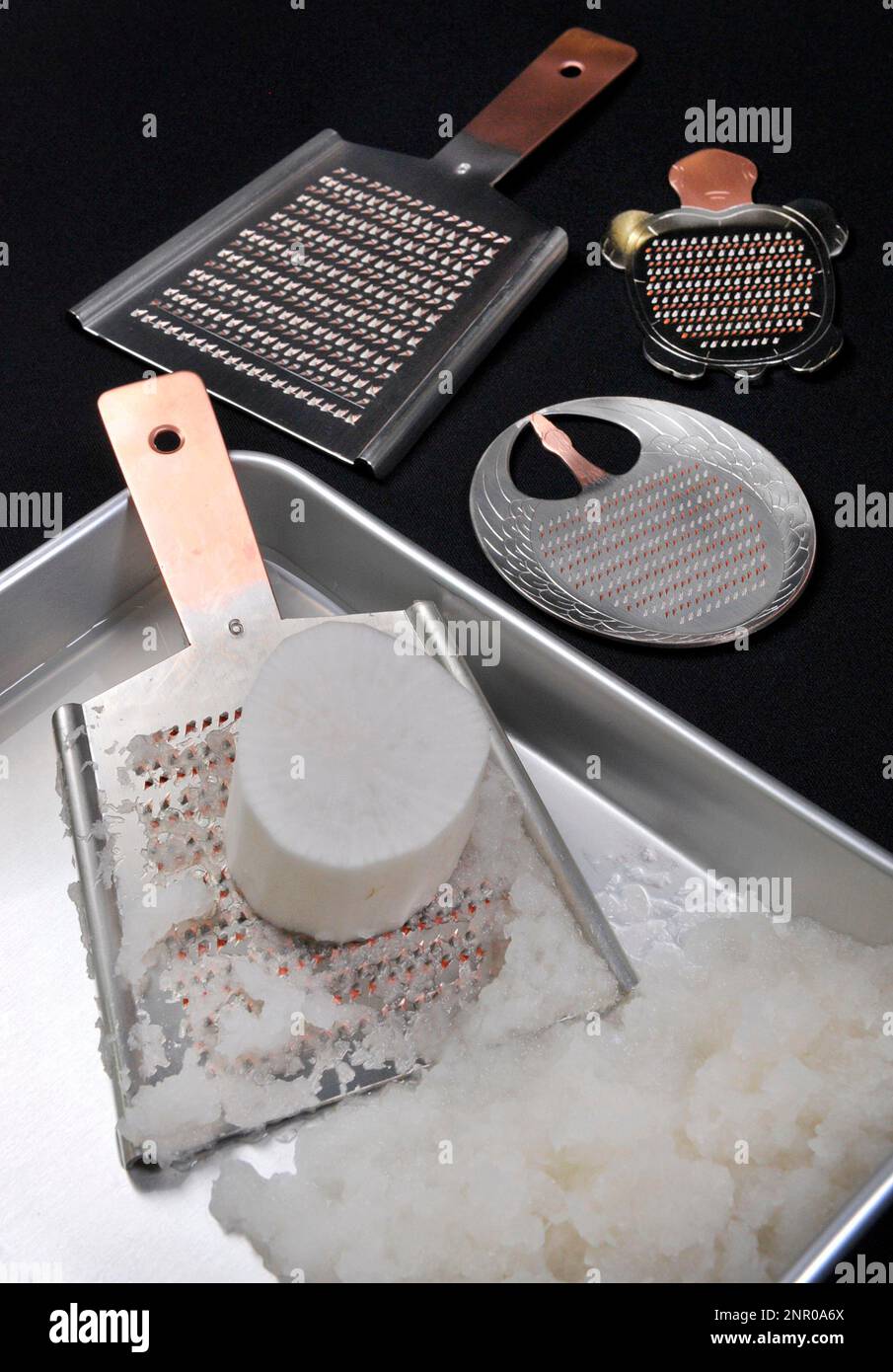 https://c8.alamy.com/comp/2NR0A6X/a-picture-shows-japanese-grater-oroshigane-and-grated-japanese-radish-daikon-oroshi-in-tokyo-on-may-29-2020-the-trapezoidal-grater-is-the-traditional-japanese-grater-the-yomiuri-shimbun-via-ap-images-2NR0A6X.jpg
