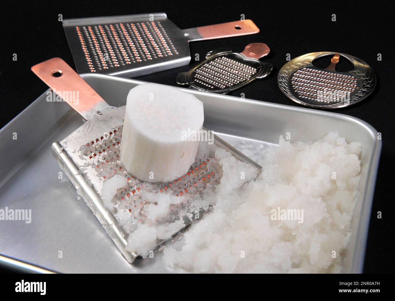 https://c8.alamy.com/comp/2NR0A7H/a-picture-shows-japanese-grater-oroshigane-and-grated-japanese-radish-daikon-oroshi-in-tokyo-on-may-29-2020-the-trapezoidal-grater-is-the-traditional-japanese-grater-the-yomiuri-shimbun-via-ap-images-2NR0A7H.jpg