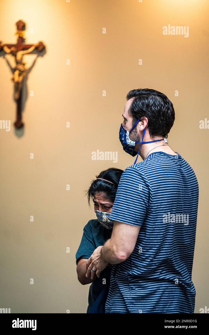 Scott Himmer and his wife Marina of St. Paul embrace after receiving
