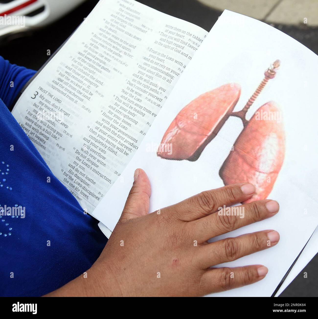Melissa Baker keeps a picture of a healthy set of lungs in her Bible as a poignant reminder to