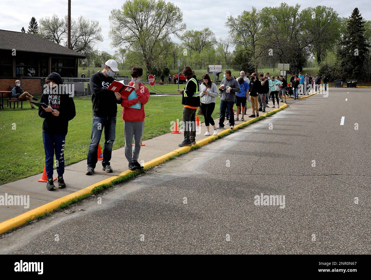 People wait in line at a driver exam station of the Minnesota