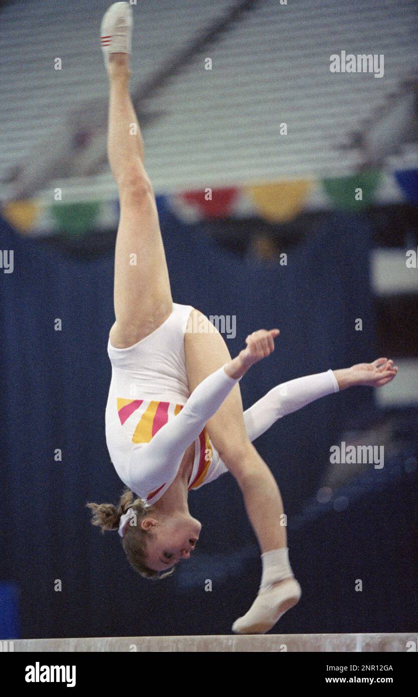 Soviet gymnast Svetlana Boginskaya competes on the balance beam at the