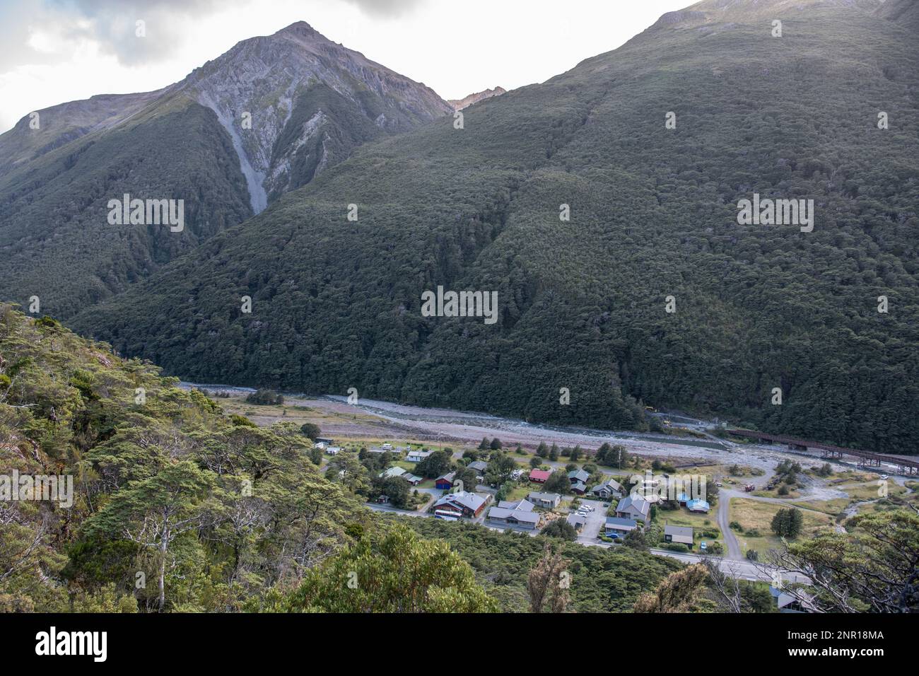 Arthurs pass village in a mountain valley in the Southern Alps of New Zealand seen from above. Stock Photo