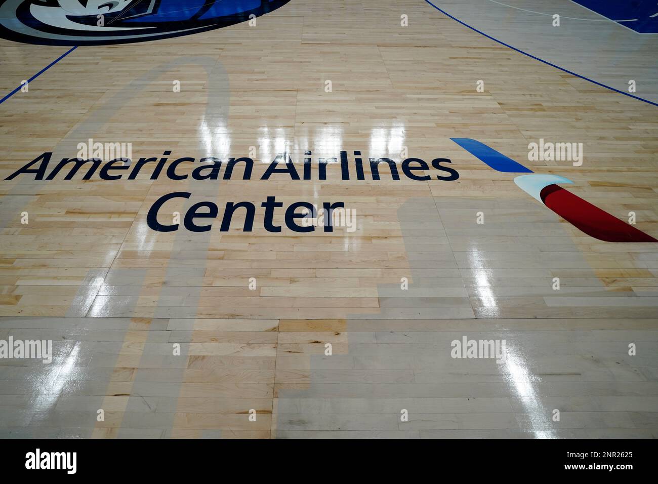 In a courtside view the Dallas skyline is seen painted on the court below  the American Airlines Center name before an NBA basketball game between the  Memphis Grizzlies and the Dallas Mavericks