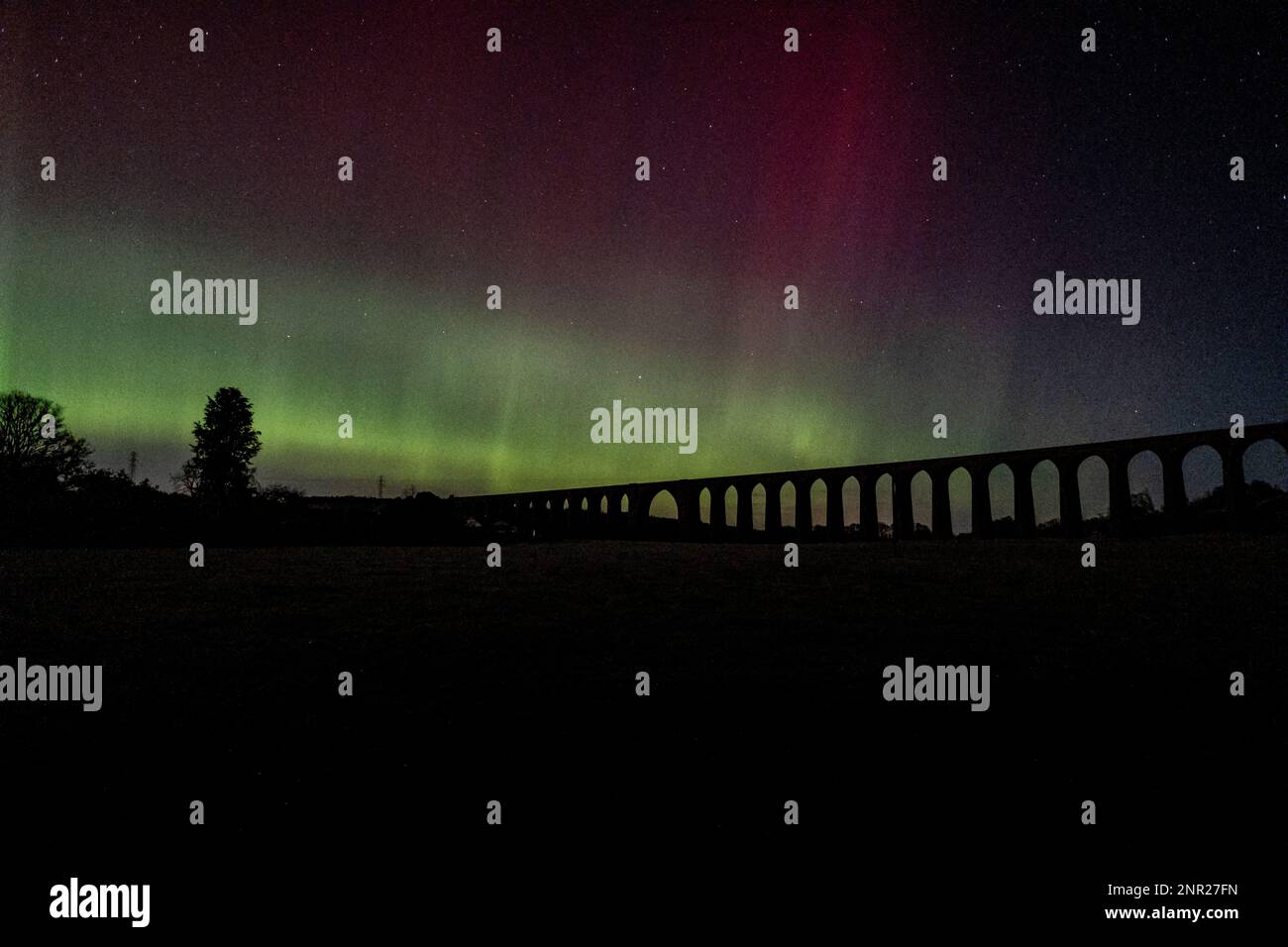 The Aurora Borealis (Northern Lights) light up the sky above the Culloden Viaduct, near Inverness in the Highlands of Scotland. Stock Photo